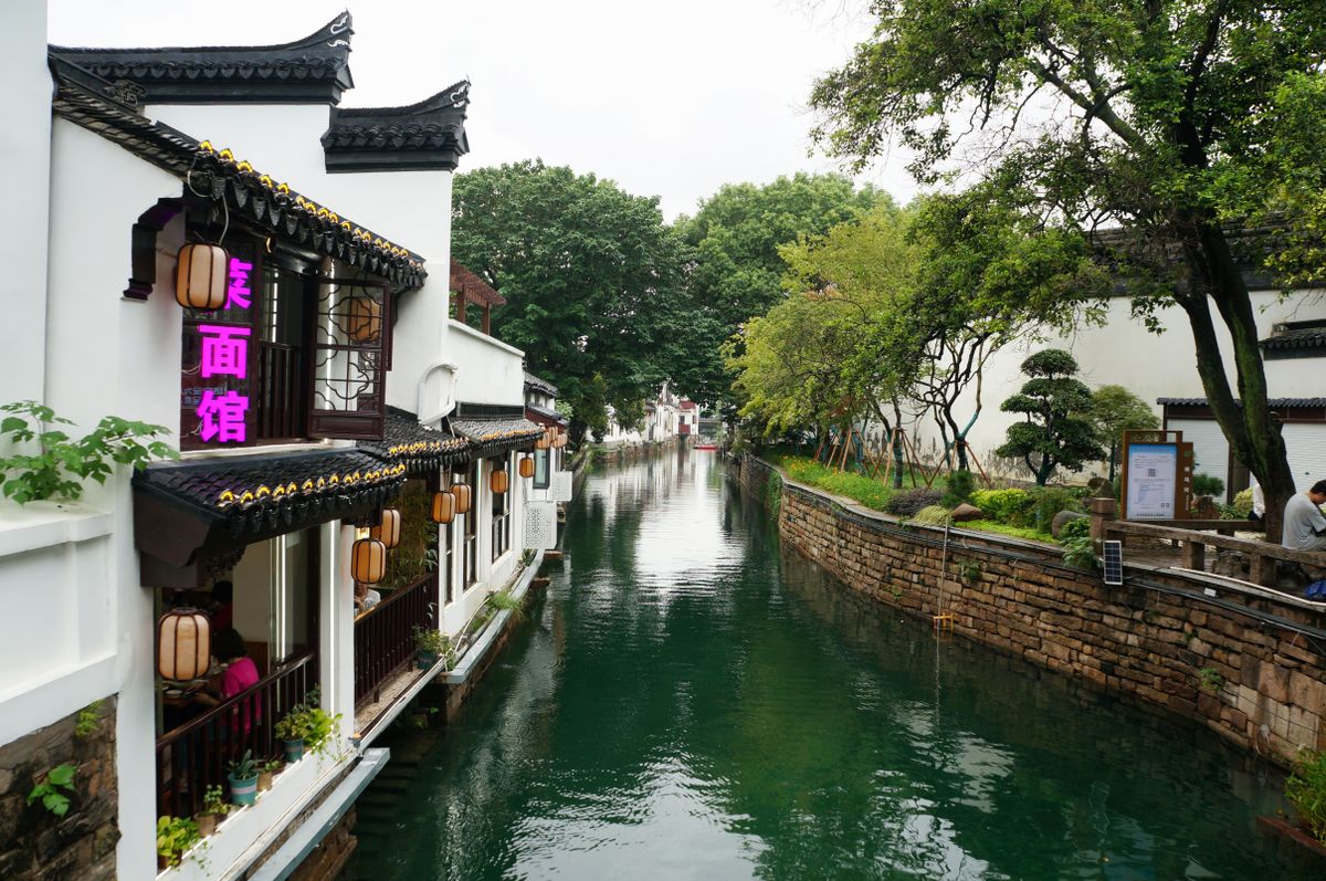 Suzhou old town canal lined with traditional houses and lanterns near Pingjiang Road