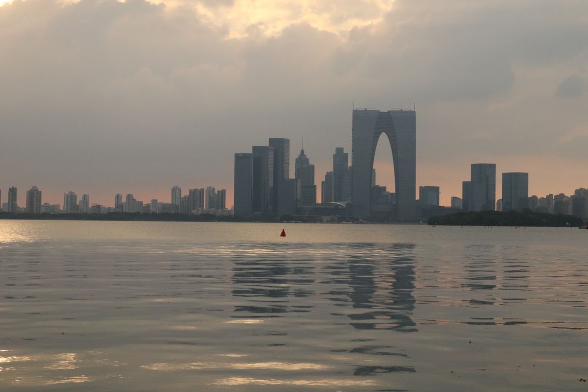 Jinji Lake shoreline with the Suzhou Industrial Park skyline in the background