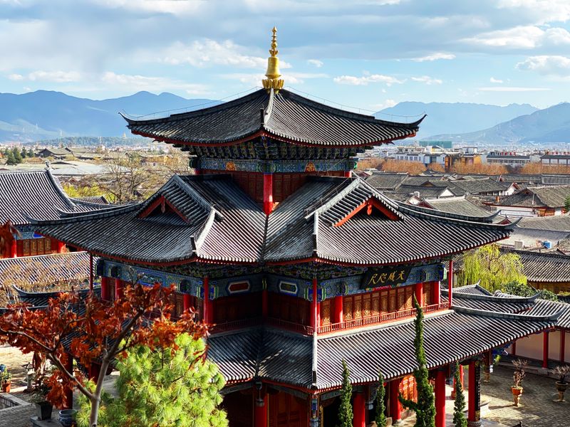 Wangu Tower rising above the tiled rooftops of Dayan Old Town, Lijiang