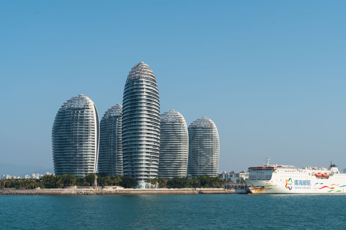 Phoenix Island skyscrapers and a cruise ship in Sanya Bay, Hainan