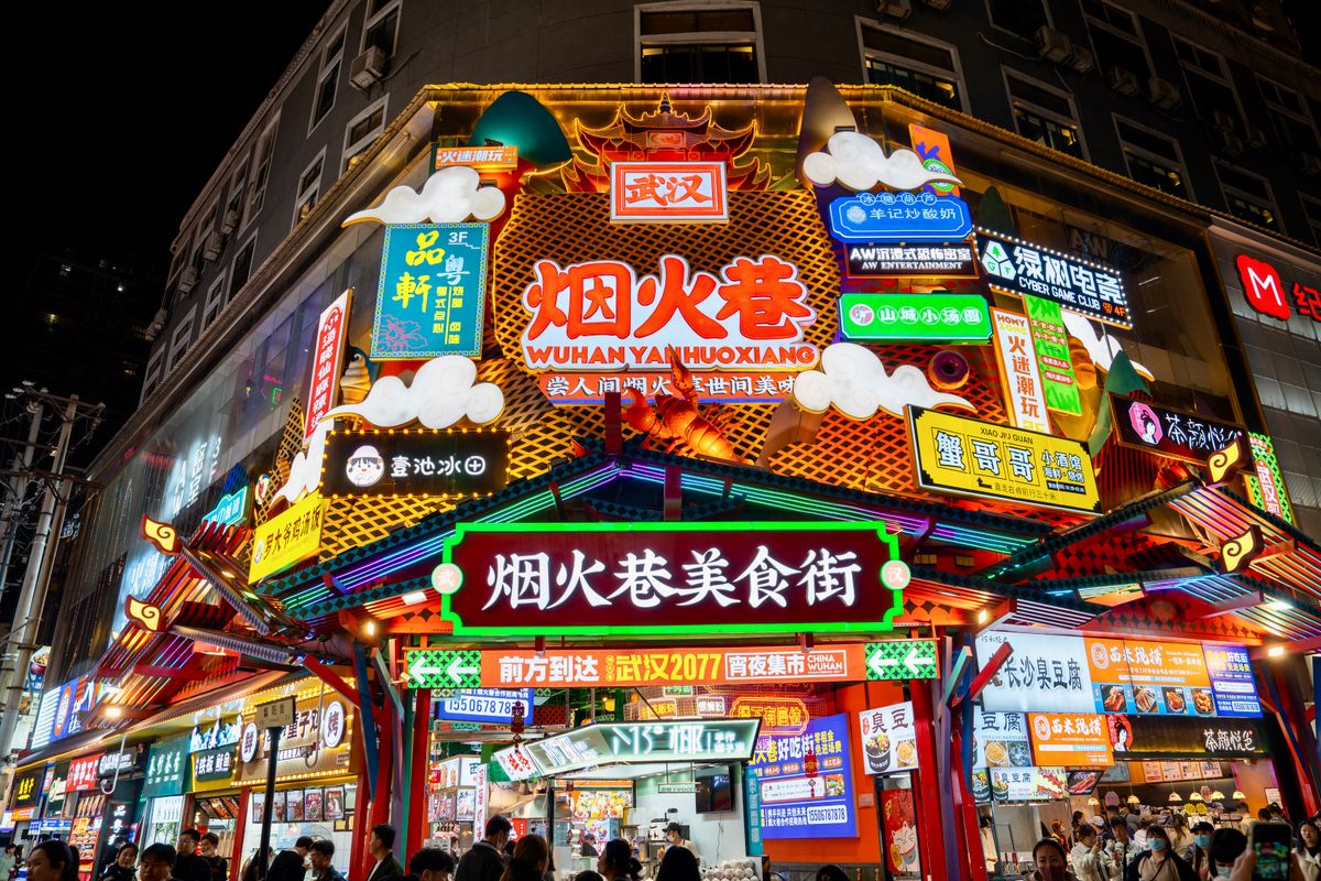 A neon-lit night food street near Jianghan Road in Wuhan