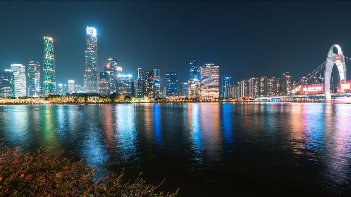 Guangzhou skyline at night reflecting on the Pearl River near Zhujiang New Town