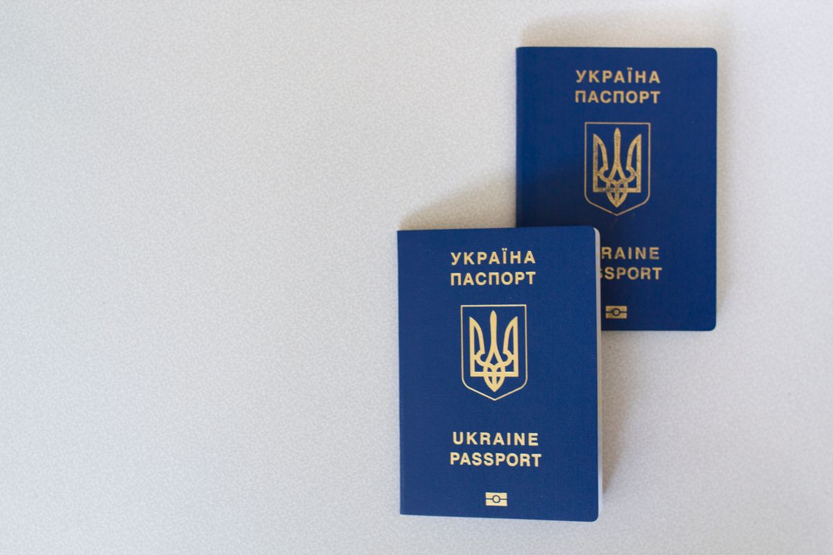 Passports next to visa application documents