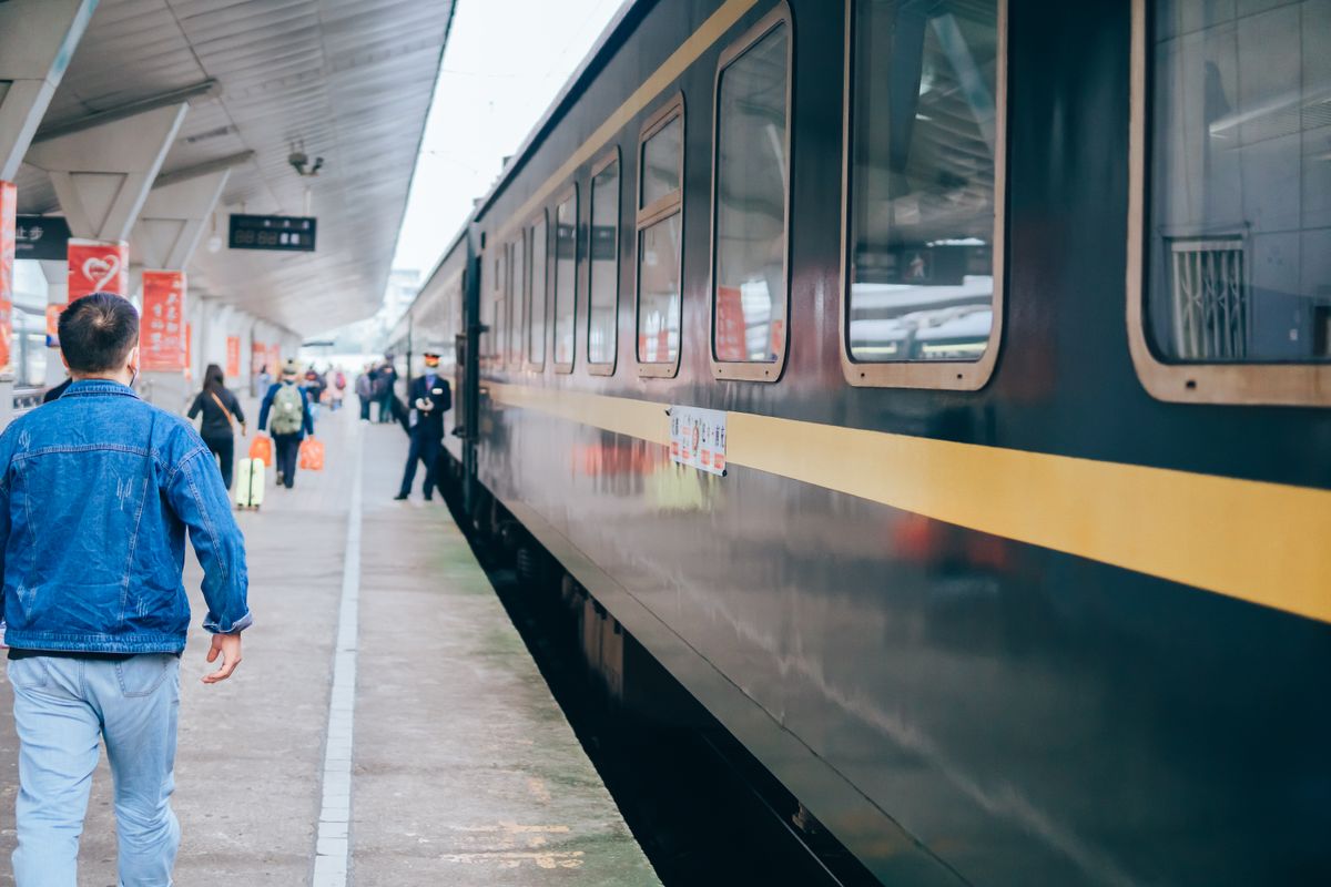 Overnight sleeper train carriage stopped at a railway platform in China