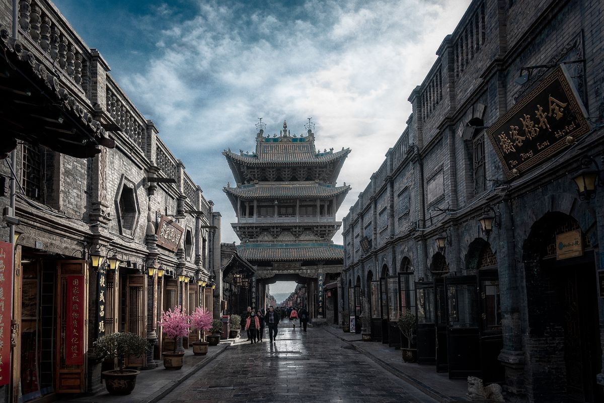 Old town street in Datong with a traditional Chinese gate tower and lanterns