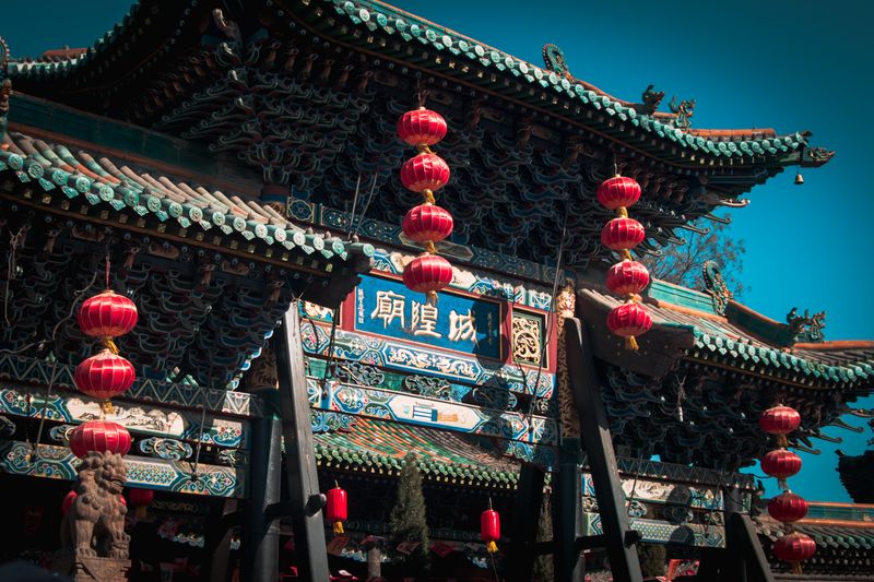 City God Temple gate in Shanxi, decorated with rows of red lanterns