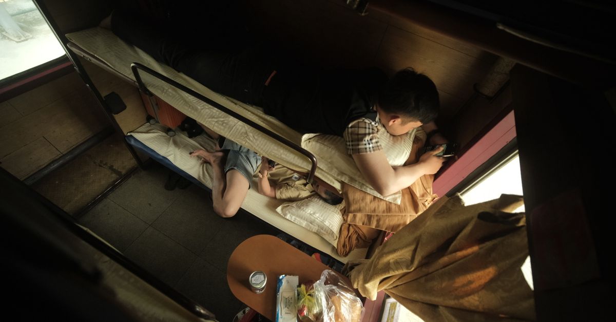 Overnight sleeper train compartment with bunk beds in China