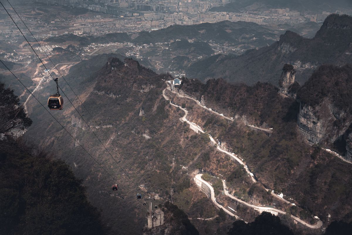 Cable cars climbing toward Tianmen Mountain above Zhangjiajie