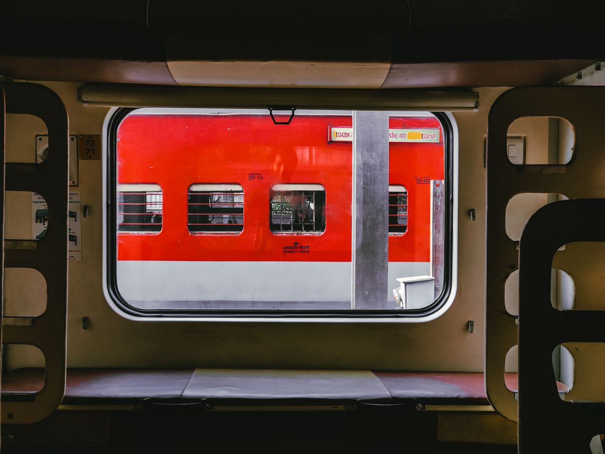 Hard sleeper compartment on an overnight Chinese train, bunks visible through the window