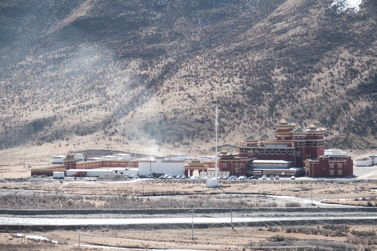 Tibetan monastery in a mountain valley along the plateau