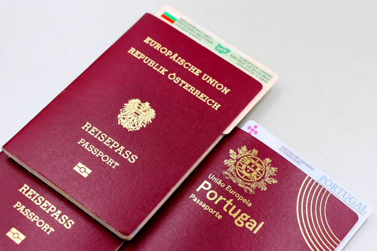 Passports laid across a European map, showing how visa-free access depends on nationality