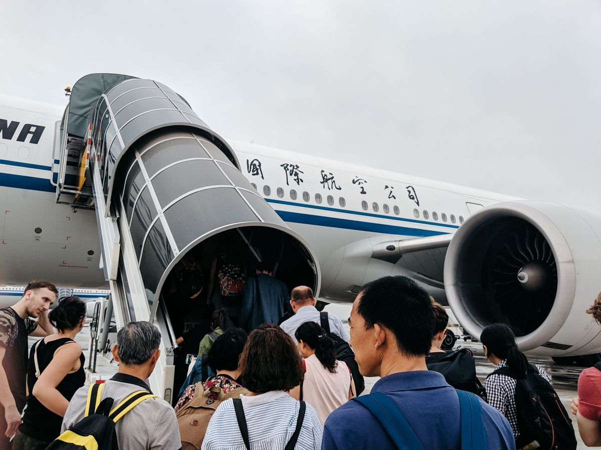 Boarding a flight bound for China