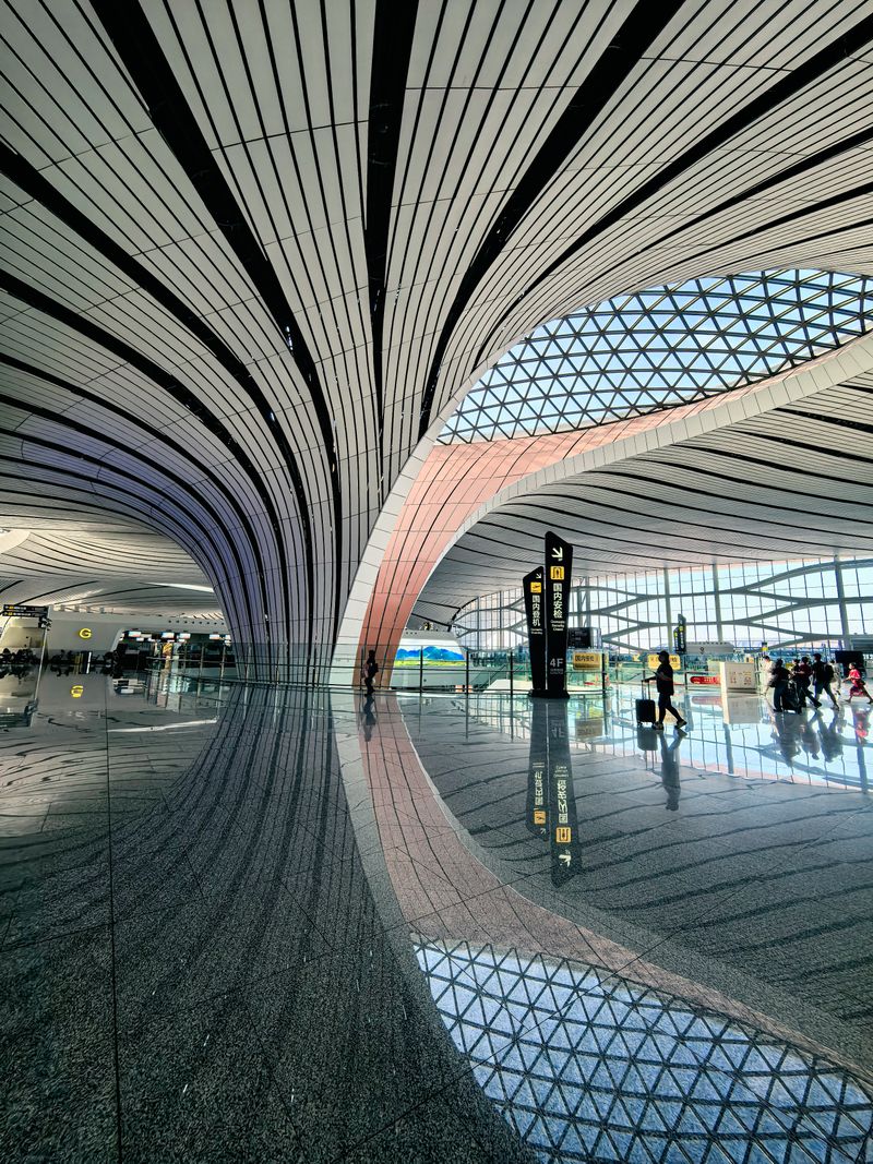 Interior of Beijing Daxing International Airport with its distinctive starfish-shaped terminal roof