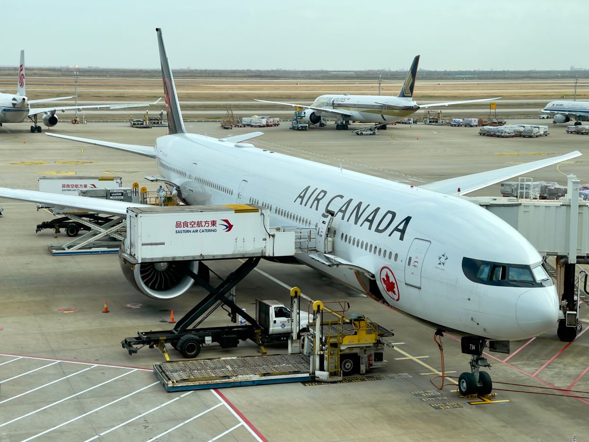 Aircraft on the tarmac at a Shanghai airport, where port-based e-visa confirmations are checked on arrival