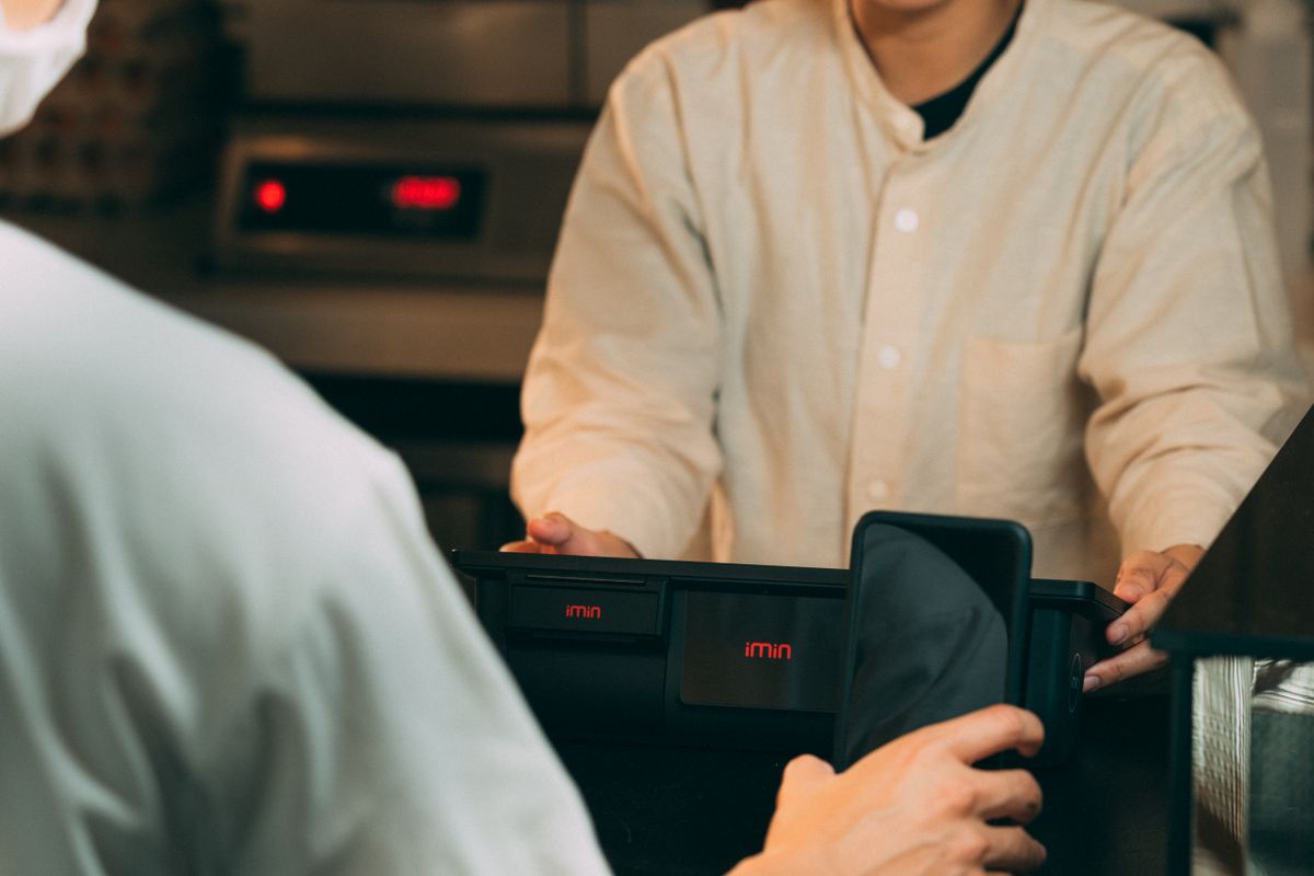 Contactless phone payment at a shop counter