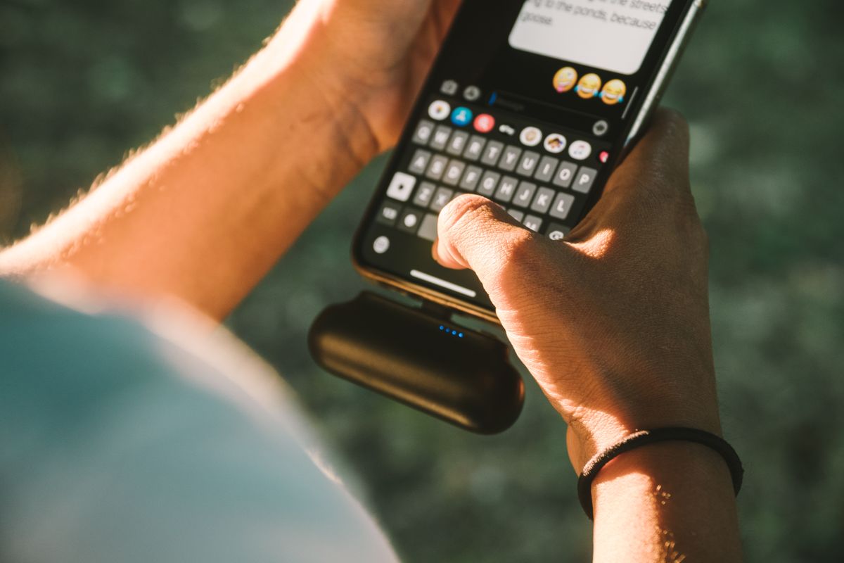 A phone charging from a portable power bank