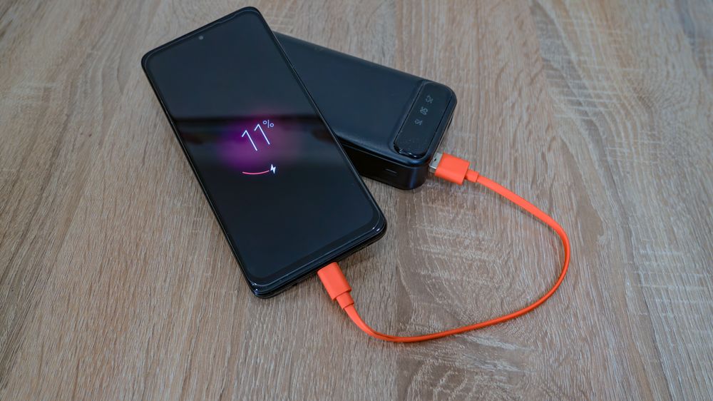 Portable charger connected to a smartphone