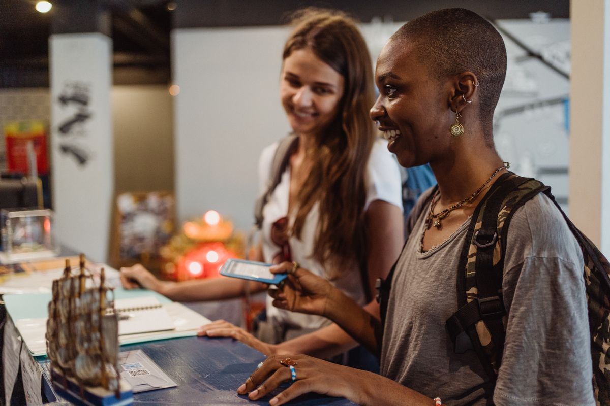 Traveler presenting a passport at a reception desk