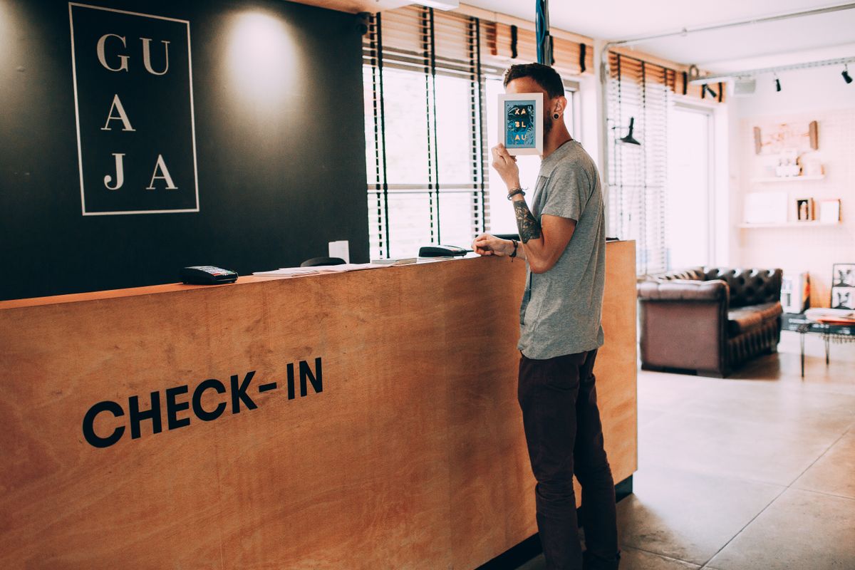 Two international travelers completing check-in details