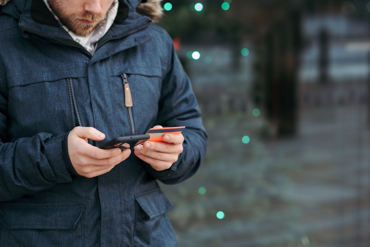 Visitor pays by smartphone at a card terminal