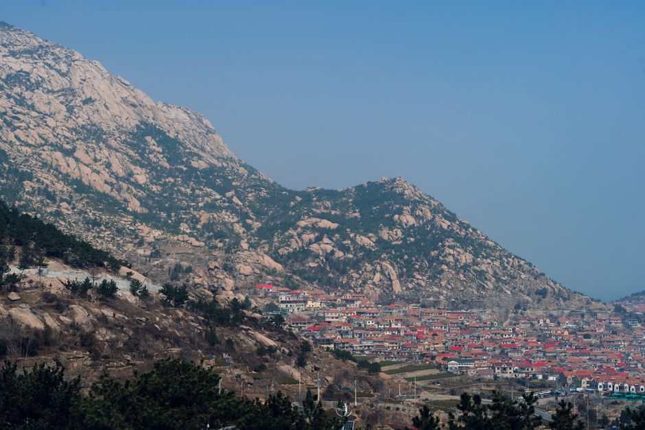 Granite slopes and village at Laoshan