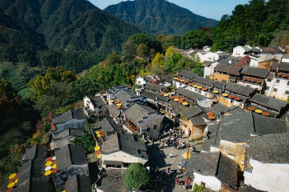 Aerial photograph showcasing the picturesque Wuyuan village nestled in China's autumn landscape.